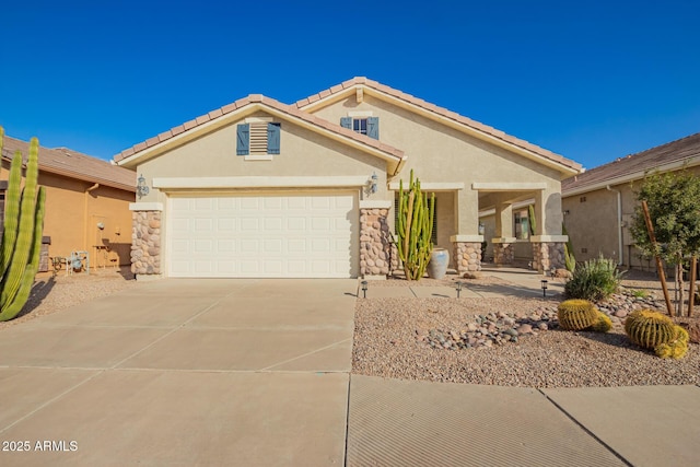 view of front facade with a garage, stone siding, driveway, and stucco siding