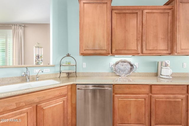 kitchen featuring a sink, light countertops, and stainless steel dishwasher