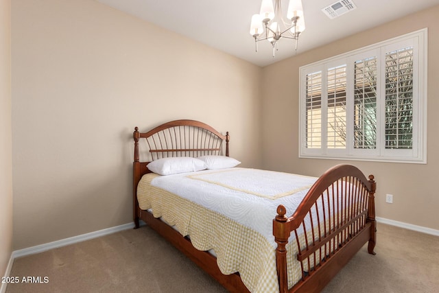 bedroom with an inviting chandelier, baseboards, visible vents, and carpet flooring