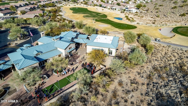 birds eye view of property with golf course view and a residential view