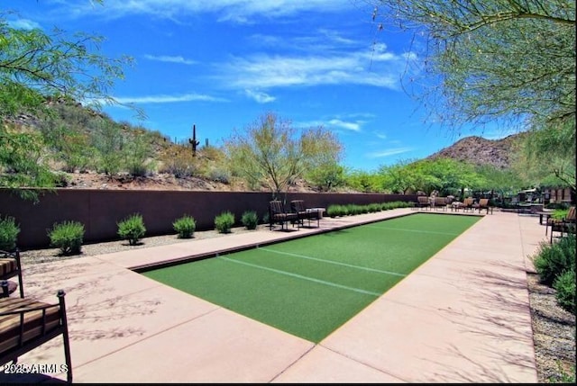 surrounding community featuring a mountain view