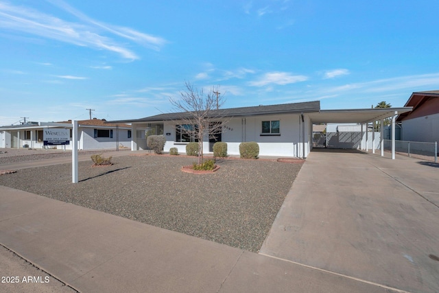 view of front of home with a carport