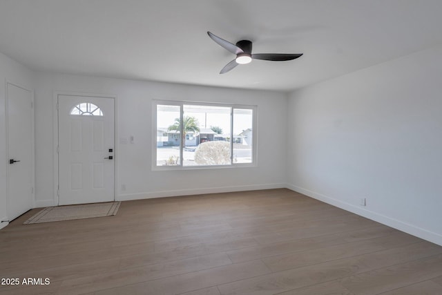 foyer featuring ceiling fan and light hardwood / wood-style flooring