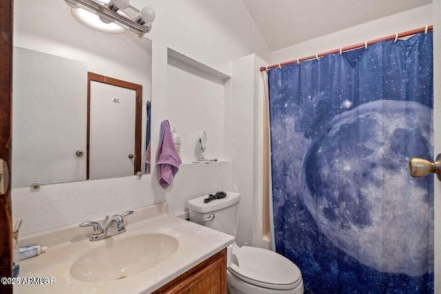 bathroom with toilet, vanity, and shower / tub combo with curtain