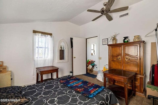 bedroom with ceiling fan, lofted ceiling, carpet floors, and visible vents