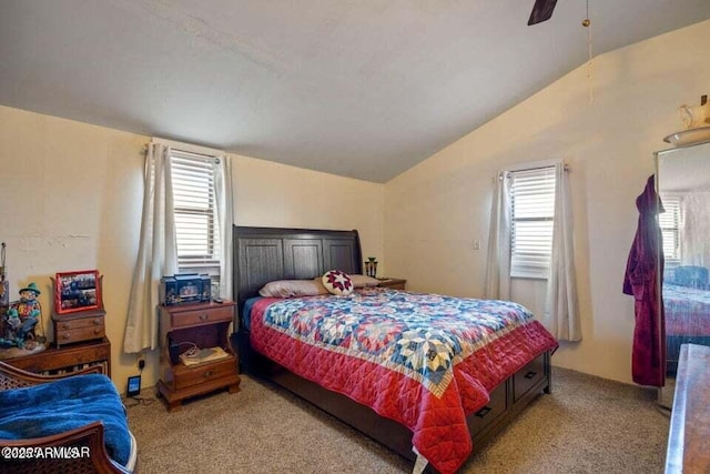 carpeted bedroom featuring vaulted ceiling and ceiling fan