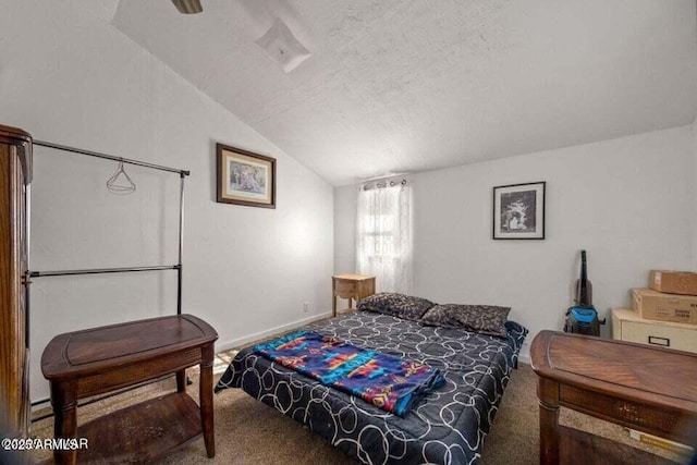 carpeted bedroom with vaulted ceiling, baseboards, and a textured ceiling