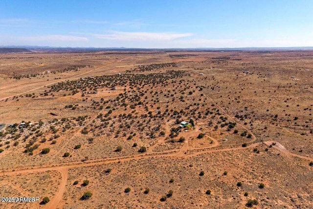 bird's eye view with a rural view and view of desert