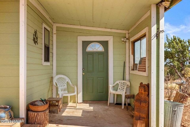 property entrance with covered porch