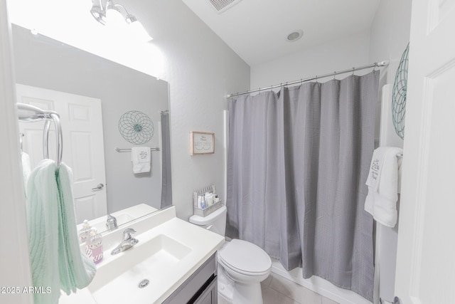 bathroom featuring tile patterned flooring, toilet, a shower with shower curtain, visible vents, and vanity