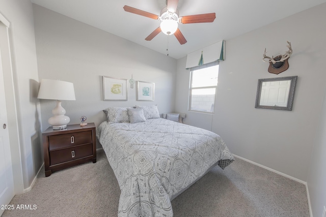 bedroom featuring a ceiling fan, carpet, and baseboards