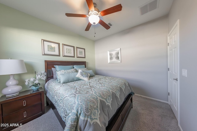 carpeted bedroom featuring visible vents, ceiling fan, and baseboards