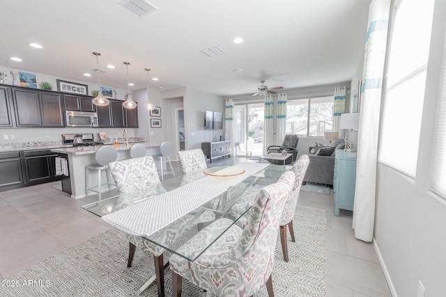 dining room featuring light tile patterned floors, recessed lighting, visible vents, a ceiling fan, and baseboards