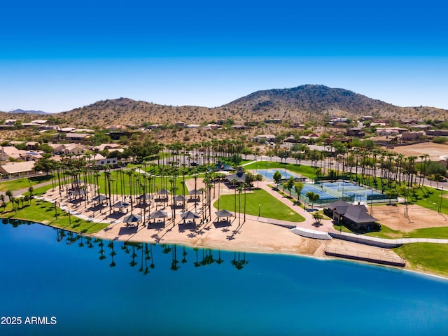 drone / aerial view featuring a water and mountain view