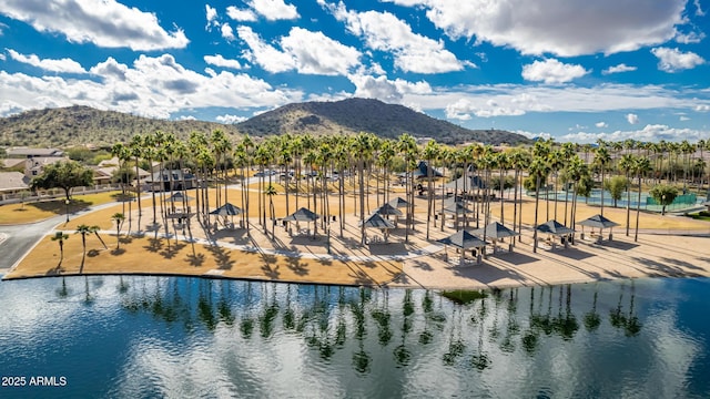 drone / aerial view with a water and mountain view