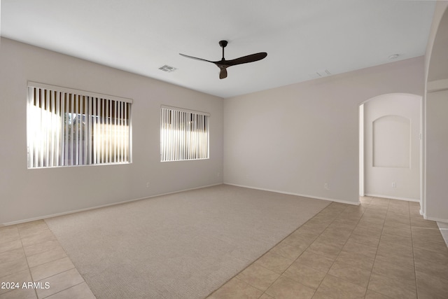 carpeted empty room with ceiling fan