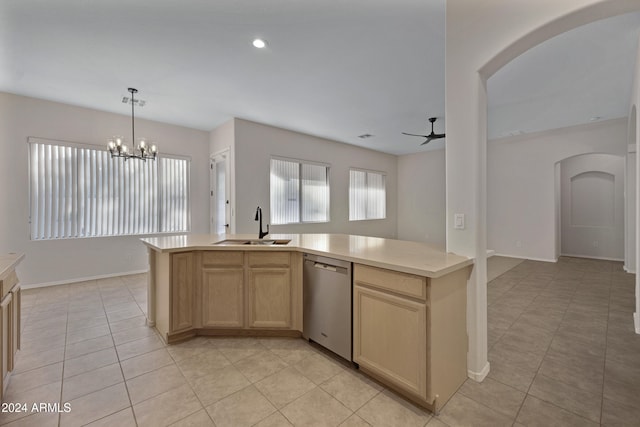 kitchen featuring light tile patterned floors, light brown cabinets, sink, dishwasher, and ceiling fan with notable chandelier