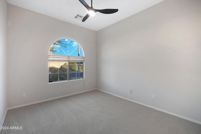 unfurnished room with ceiling fan and carpet flooring