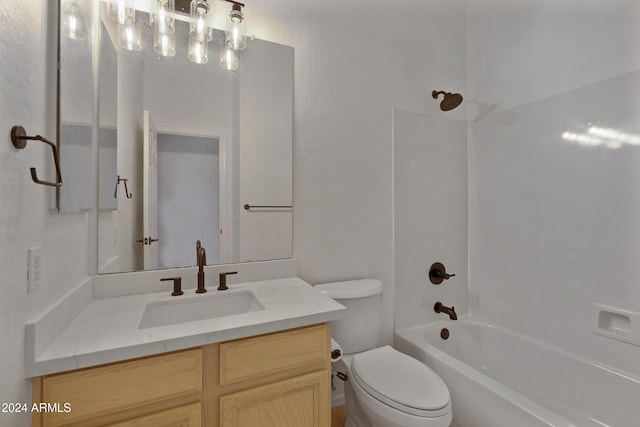 full bathroom with washtub / shower combination, vanity, and toilet