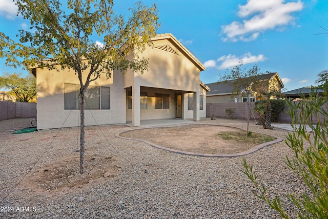 back of property featuring a patio area