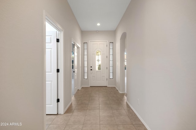 doorway to outside featuring light tile patterned floors