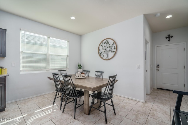 dining space with light tile patterned flooring