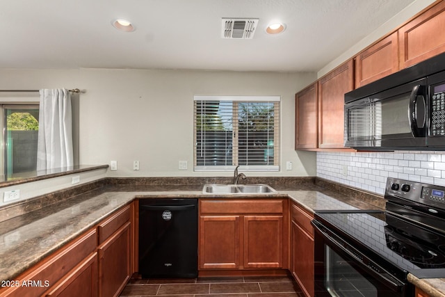 kitchen with recessed lighting, a sink, visible vents, decorative backsplash, and black appliances