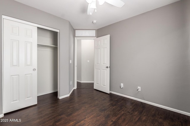 unfurnished bedroom featuring ceiling fan, a closet, dark wood finished floors, and baseboards