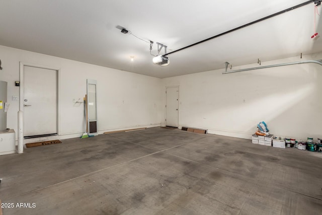 garage featuring a garage door opener and water heater