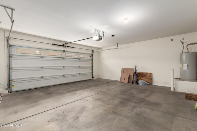 garage featuring electric water heater and a garage door opener