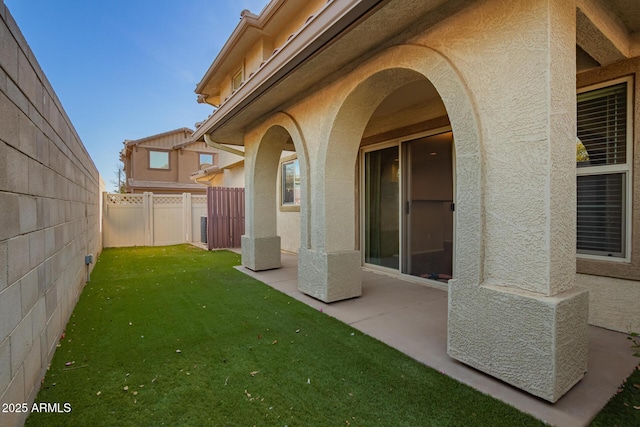 view of yard with a patio and a fenced backyard