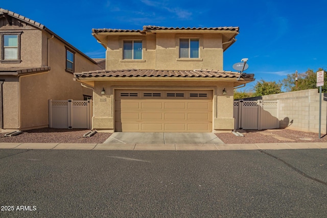 view of front facade with fence, a gate, and stucco siding