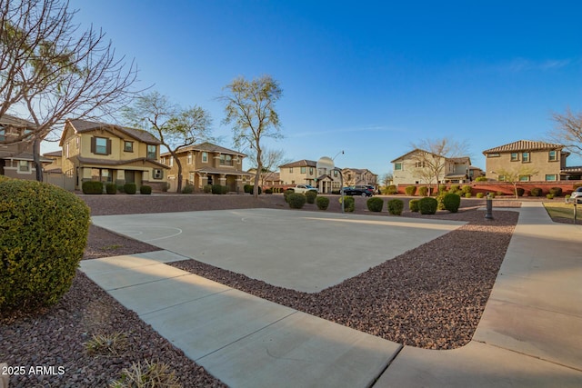 view of sport court with community basketball court and a residential view