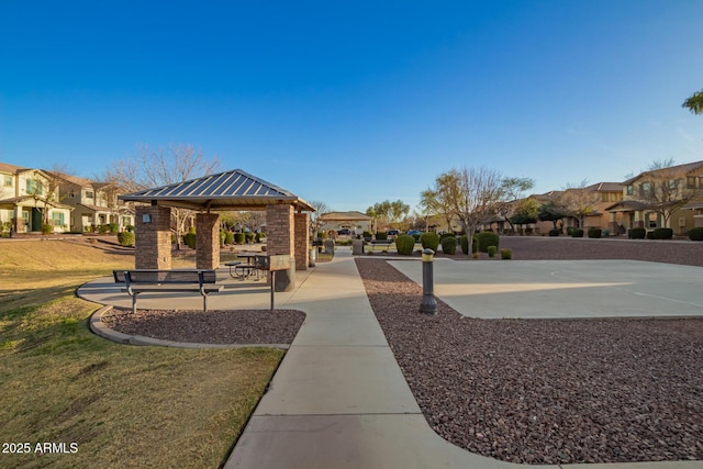 view of home's community with a gazebo, a yard, and a residential view