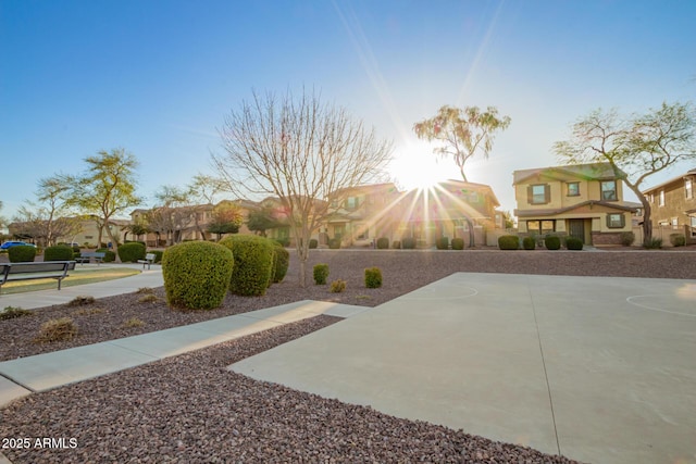 exterior space featuring community basketball court and a residential view