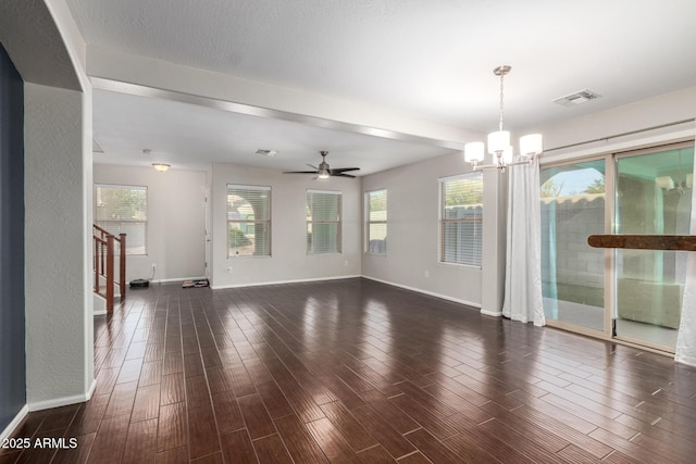 interior space featuring dark wood-type flooring, visible vents, stairway, and baseboards