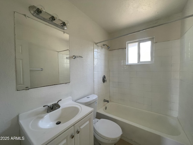 full bathroom featuring vanity, toilet, and tiled shower / bath