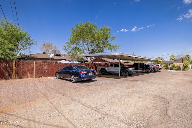 view of parking / parking lot featuring a carport