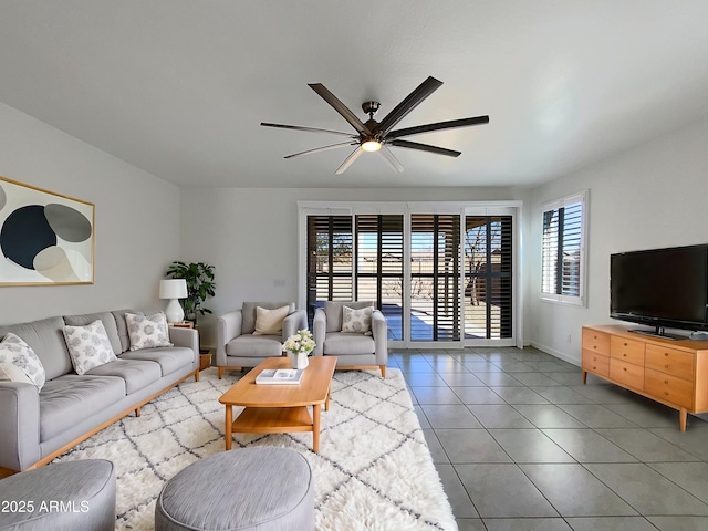 tiled living room featuring ceiling fan