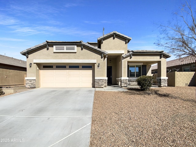 view of front of home featuring an attached garage, stone siding, concrete driveway, and stucco siding