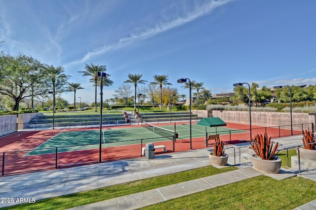 view of tennis court with fence