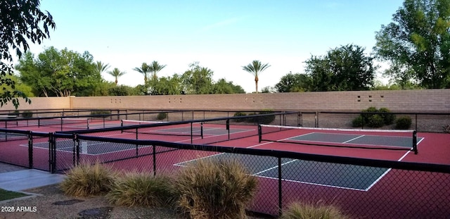 view of sport court with fence