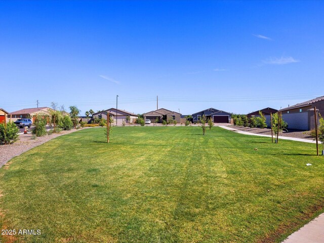 view of yard featuring a residential view