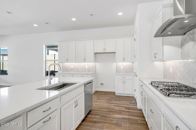 3310 Iron King Cir, Prescott, AZ 86301 - kitchen featuring wall chimney range hood, stainless steel appliances, white cabinets, and a sink