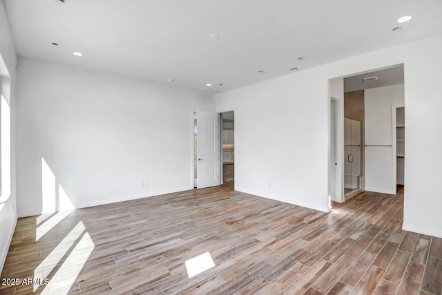3310 Iron King Cir, Prescott, AZ 86301 - unfurnished room with baseboards, light wood finished floors, and recessed lighting