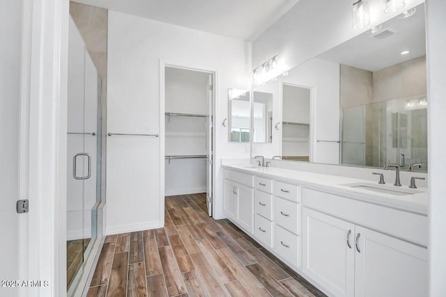 3310 Iron King Cir, Prescott, AZ 86301 - bathroom with a stall shower, a sink, a spacious closet, and wood tiled floor
