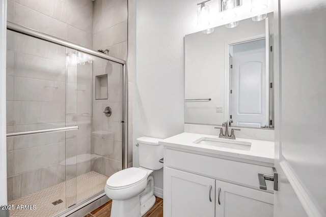 3310 Iron King Cir, Prescott, AZ 86301 - bathroom with toilet, wood finished floors, vanity, and a stall shower