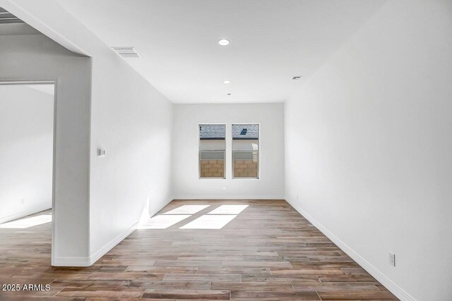 3310 Iron King Cir, Prescott, AZ 86301 - empty room featuring visible vents, baseboards, recessed lighting, and wood finished floors