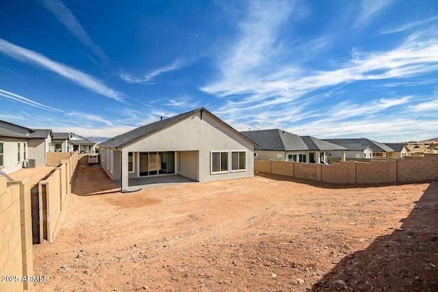 3310 Iron King Cir, Prescott, AZ 86301 - rear view of property featuring a fenced backyard, central air condition unit, a residential view, and stucco siding