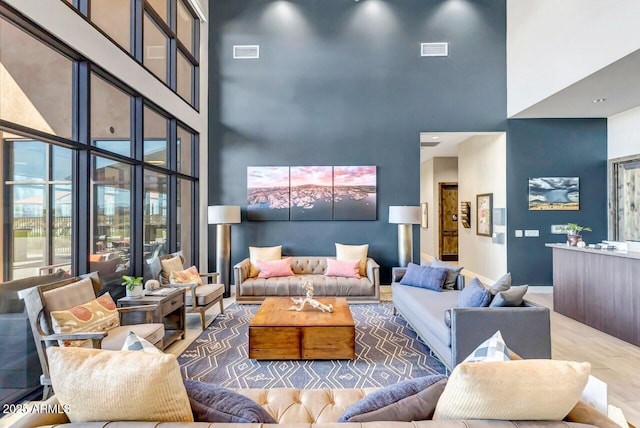 3310 Iron King Cir, Prescott, AZ 86301 - living room featuring visible vents, baseboards, and a towering ceiling